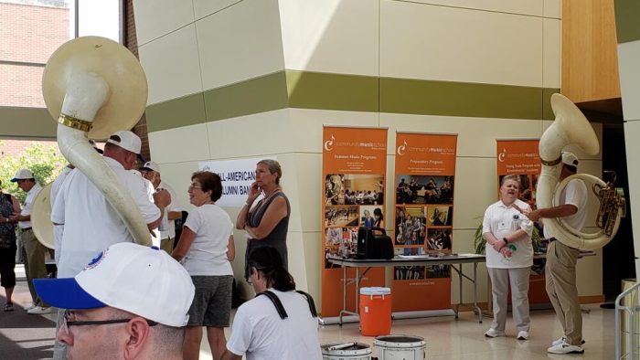 Sousaphone "fittings" before marching rehearsal Sousaphone "fittings" before marching rehearsal