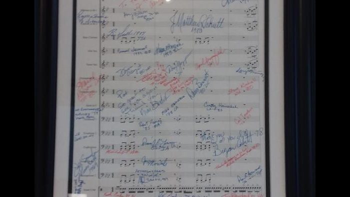 Signed score of “Healey’s Heroes” a march composed by Kim Scharnberg and named for Pat Healey, longtime Golin Communications account executive who spearheaded 13 years of the MAAB. Signed score of “Healey’s Heroes”
