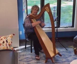 Donna Bennett playing harp